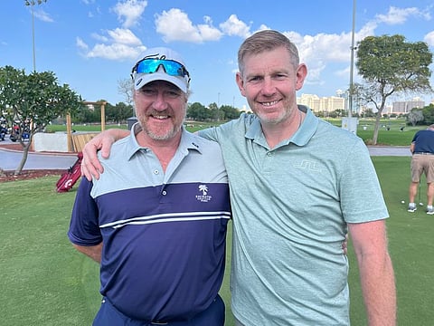 Captain of Emirates Golf Club, Campbell Steedman (left) with DP World Tour golfer Stephen Gallacher during a recent round of golf in Dubai