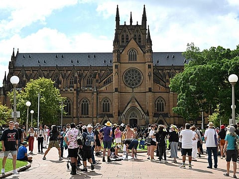 Protesters gather in front of St. Mary's Cathedral during the funeral of late Australian Catholic Cardinal George Pell in Sydney on February 2, 2023.  