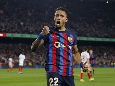 Barcelona's Raphinha celebrates scoring against Sevilla at the Camp Nou, Barcelona, Spain.