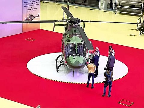 Prime Minister Narendra Modi during the unveiling of the light utility helicopter at HAL's helicopter manufacturing factory, in Tumakuru on Monday, Feb 6, 2023. Defence Minister Rajnath Singh also seen.