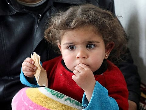 Miracle child: Raghad Ismail, the Syrian toddler who was rescued from rubble of a collapsed building following an earthquake, sits on the laps of her uncle at his home in Azaz, Syria February 6, 2023.