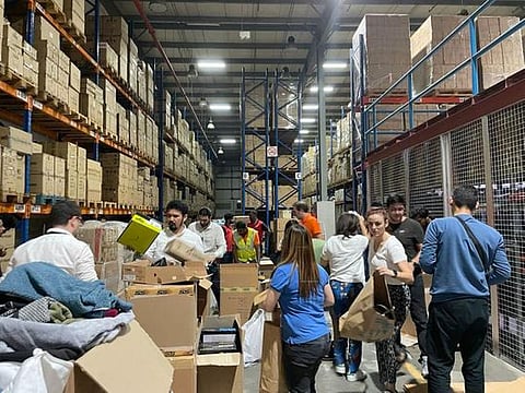 Residents at a warehouse in Dubai's Al Quoz, where the collection drive was being organised.