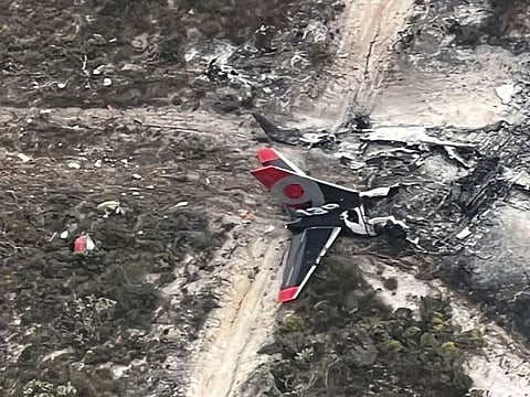 A handout photo taken on February 7, 2023 and received on February 8 from the West Australian Department of Fire and Emergency Services shows the burnt out wreackage of Boeing 737 water-bombing plane which crashed and burned while fighting a blaze 460kms south-west of the West Australian city of Perth. 