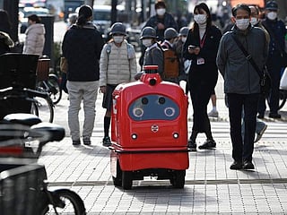 Photos: Japan rolls out 'humble and lovable' delivery robots