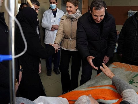 Syrian President Bashar Al Assad and his wife Asma visit an elderly man who survived the earthquake, at Aleppo university hospital, Syria,  on February 10, 2023.  