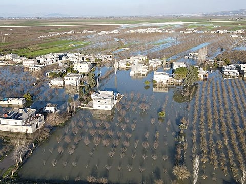 Streets, wheat and bean fields were completely flooded in the village near the Turkish border.