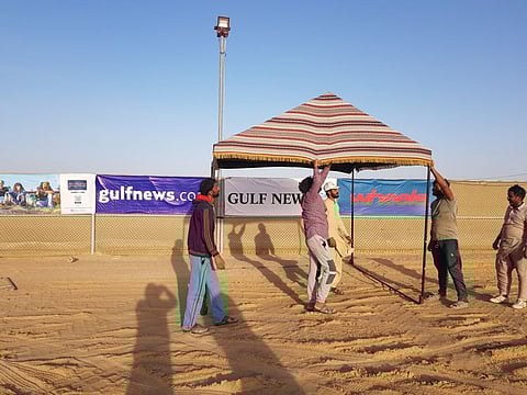 Final preparations at the Gulf News Overnighter Fun Drive camp in the desert. Hundreds of partcipants are expected to converge here this weekend.