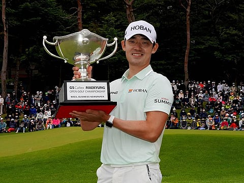 Bi-o Kim with the GS Caltex Maekyung Open Golf Championship trophy
