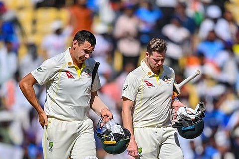 Australia's Scott Boland (left) and teammate Steven Smith walk off the ground after India's win in the first Test at the Vidarbha Cricket Association (VCA) Stadium in Nagpur.