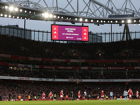 The big screen at the Emirates Stadium displays the VAR decision.