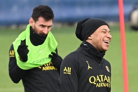 Paris Saint-Germain's Kylian Mbappe (front) and Lionel Messi take part in a training session at the club's "Camp des Loges" training ground in Saint-Germain-en-Laye, west of Paris.