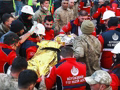 A woman is rescued from the rubble of a building some 203 hours after last week's devastating earthquake, in Hatay, Turkey.