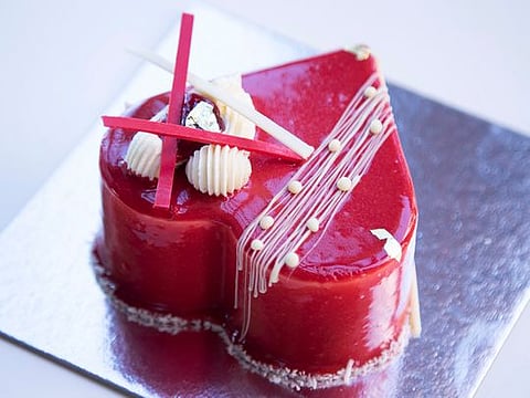 Raspberry madeleine cake with vanilla mousse and a red glaze