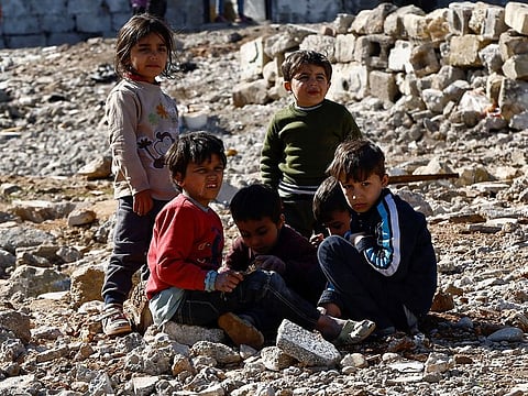 Displaced Syrian children sit at a temporary accommodation centre erected to support people affected by a devastating earthquake in Gaziantep, Turkey, February 14, 2023.