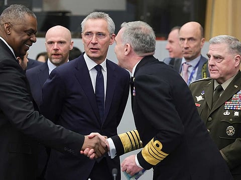 United States Secretary of Defence Lloyd Austin, left, NATO Secretary General Jens Stoltenberg, centre left,and Joint Chiefs Chairman Gen. Mark Milley, right, are seen during the North Atlantic Council round table meeting of NATO defence ministers at NATO headquarters in Brussels, Tuesday, Feb. 14, 2023. 