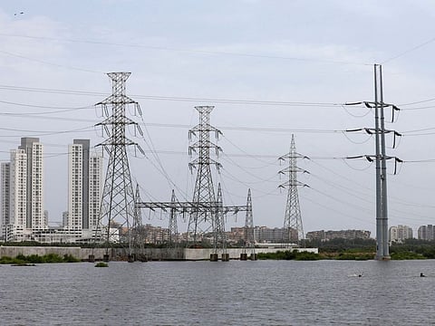 Power transmission towers Karachi. The maximum power demand met by Pakistan during the year ended June 2022 was 28.25 GW, more than 35 per cent lower than power generation capacity of 43.77 GW.