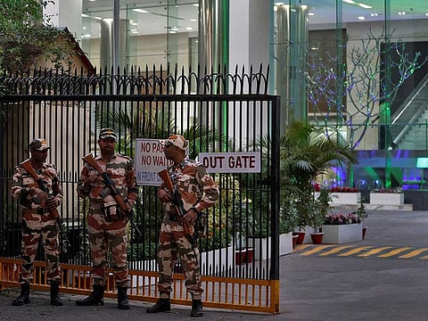 Members of the Indo-Tibetan Border Police (ITBP) stand guard outside a building housing BBC offices, where income tax officials are conducting a search for a second day, in New Delhi, India, February 15, 2023. 
