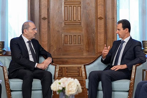 Syria's President Bashar Al Assad (right) meeting with Jordan's Foreign Minister Ayman Safadi in the capital Damascus on February 15, 2023. 