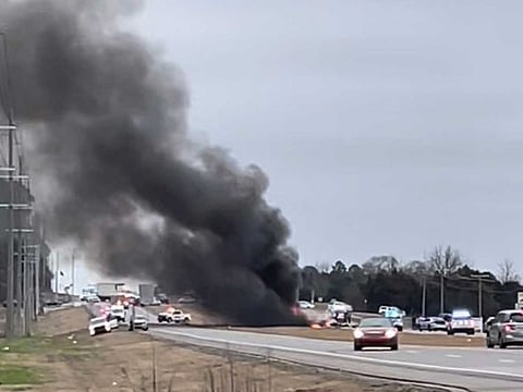 Law enforcement work at the scene of a Black Hawk helicopter crash Wednesday, Feb. 15, 2023, in the unincorporated community of Harvest, Ala. U.S. military officials say two people on board the helicopter, which was from the Tennessee National Guard, were killed. 