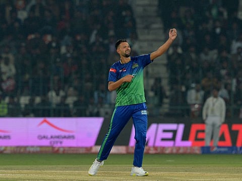 Multan Sultans Ihsanullah celebrates the wicket of Lahore Qalandars' Kamran Ghulam during the Pakistan Super League match at Multan Cricket Stadium in Multan.