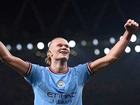 Manchester City's Norwegian striker Erling Haaland celebrates at the end of the Premier League against Arsenal at Emirates Stadium in London.