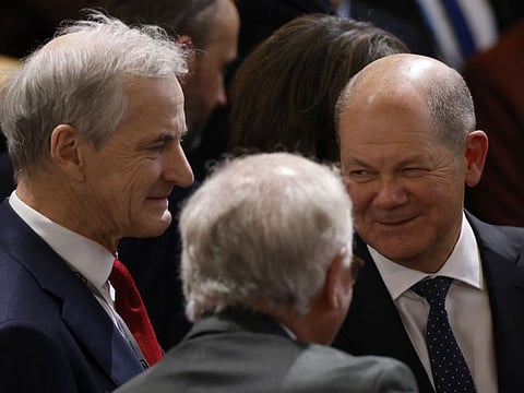 German Chancellor Olaf Scholz (right) stands next to Norway's Prime Minister Jonas Gahr Store (left) as they attend the Munich Security Conference (MSC) in Munich, southern Germany, on February 17, 2023. 