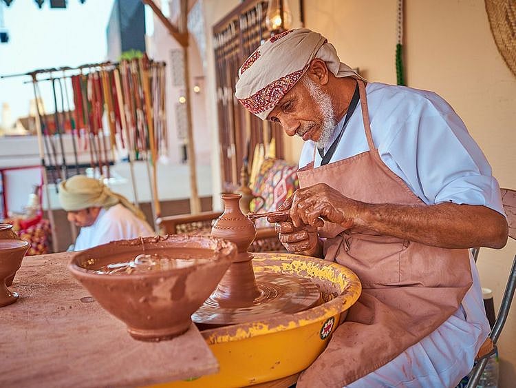 An Emirati potter at Heritage Village