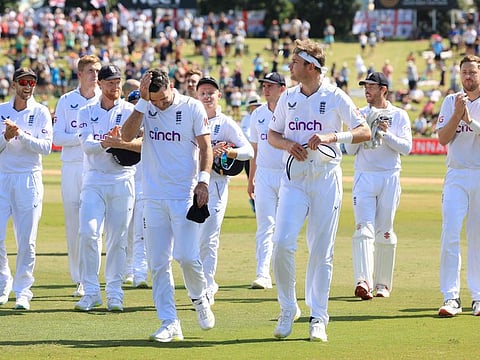 England's James Anderson (front left) walks from the field with teammate Stuart Broad (front-right) and other team members after their win during day four of the first cricket Test match against New Zealand at Bay Oval in Mount Maunganui.