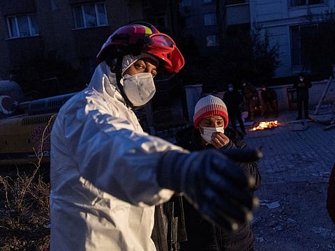 A member of a search team tells the niece of Leyla Habip and Nejat Habip that they have been found dead in their house, in the aftermath of the deadly earthquake in Hatay, Turkey, February 18, 2023. 