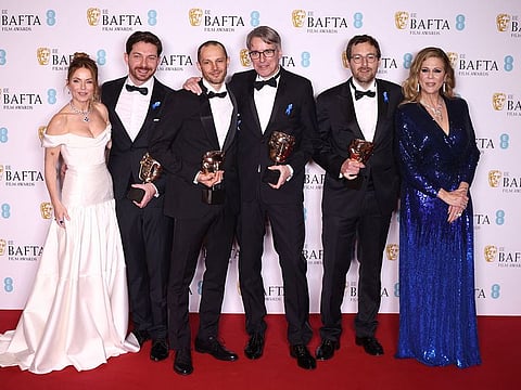  Viktor Prasil, Markus Stemler, Frank Kruse and Lars Ginzel pose with their awards for Best Sound for "All Quiet On The Western Front" alongside their awards presenters, Geri Horner and Rita Wilson during the 2023 British Academy of Film and Television Arts (BAFTA) Film Awards at the Royal Festival Hall in London, Britain, February 19, 2023. 