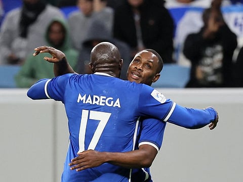 Hilal's Nigerian forward Odion Ighalo (right) celebrates with Moussa Marega after scoring during the AFC Champions League round of 16 match against UAE's Shabab Al-Ahli at the Al-Janoub Stadium in Al-Wakrah, south of Doha.