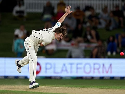 TOPSHOT - New Zealand's Blair Tickner bowls during day two of the first Test against England.