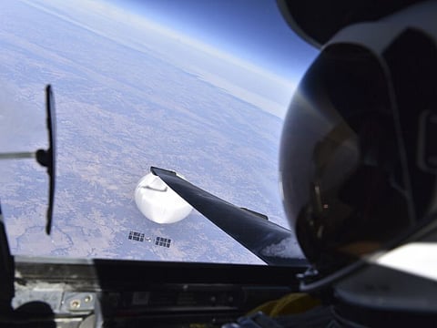 In an image provided by the Department of Defence, a US Air Force pilot looks down at the suspected Chinese surveillance balloon as it hovered over the central continental United States on Feb. 3.