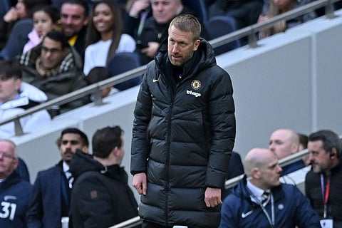 Chelsea coach Graham Potter looks down and out on the touchline during the English Premier League match against Tottenham at Tottenham Hotspur Stadium in London.