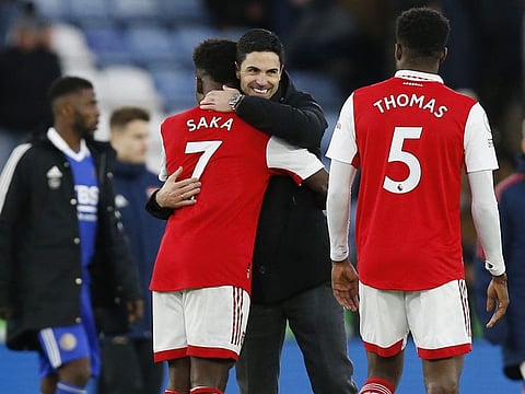 Arsenal manager Mikel Arteta celebrates with Bukayo Saka after the Premier League match against Leicester City.
