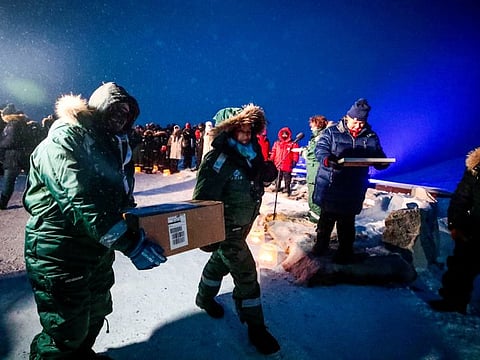 Representatives from many countries and universities arrive in the Svalbard global seed vault with new seeds, in Longyearbyen, Norway February 25, 2020, in this file photo.