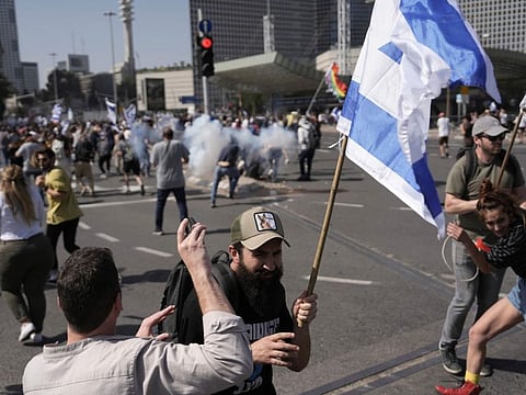 Israeli police fire stun grenades at protesters in Tel Aviv, on March 1, 2023. 