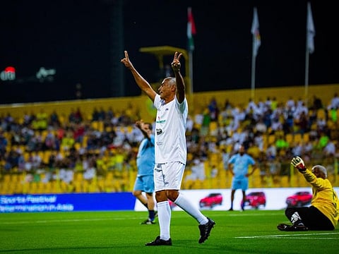 Former Brazil striker Romario celebrates after scoring in the friendly against the Asian stars at Zabeel Stadium, Dubai.