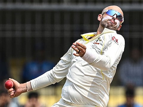 Australia's Nathan Lyon bowls during the second day of the third Test against India at the Holkar Stadium in Indore on March w, 2023.  