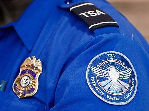 A Transportation Security Administration officer works at Dallas Love Field Airport on June 24, 2020, in Dallas. A man was arrested Monday, Feb. 27, 2023, after an explosive was found in a bag checked onto a Florida-bound flight at Lehigh Valley International Airport  in Allentown, Pa., federal authorities said. 
