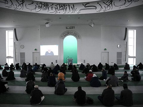 Members of the Ahmadiyya Muslim Community pray inside the Baitul Futuh Mosque in south west London on March 3, 2023, ahead its re-opening. 