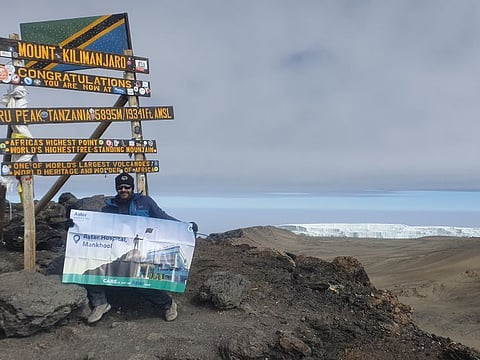 Dr Mustafa Saif at the peak of Mt Kilimanjaro at 5,895 meters above sea level
