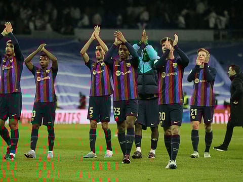FC Barcelona players applauds fans after winning the Copa del Rey match against Real Madrid on Thursday.