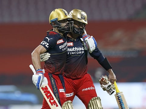 Virat Kohli and Dinesh Karthik of Royal Challengers Bangalore during a match of the TATA Indian Premier League 2022.