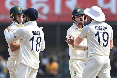 Australia's Travis Head (second from right) greets India's Umesh Yadav (right) and Marnus Labuschagne (left) greets Virat Kohli after the completion of the third Test in Indore.