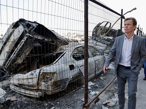 Sven Kuhn von Burgsdorff, the representative ambassador of the European Union in Palestine, tours an area with destroyed cars, as EU representatives and human rights organizations visit Palestinian families after an Israeli settlers' rampage in Huwara, in the Israeli-occupied West Bank March 3, 2023. 