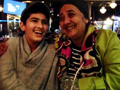 Kareem Qandeel with his aunt at a younger age