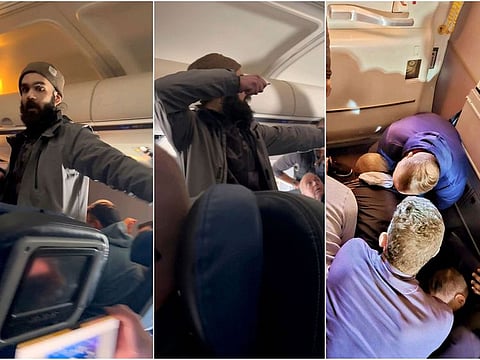 This still image from video provided by Lisa Olsen shows a man who federal authorities have identified as Francisco Severo Torres as he moves through the cabin on a weekend flight from Los Angeles to Boston, Sunday, March 5, 2023. Federal authorities said Torres tried to open the airliner's emergency exit and then tried to stab a flight attendant with a broken spoon.