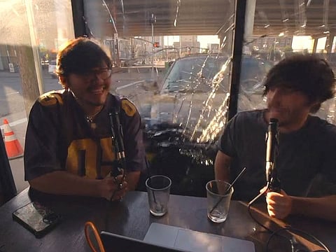 A view shows a car slamming into cafe while two men record a podcast, in Houston, Texas, U.S., March 4, 2023 in this screen grab obtained from a social media video. 