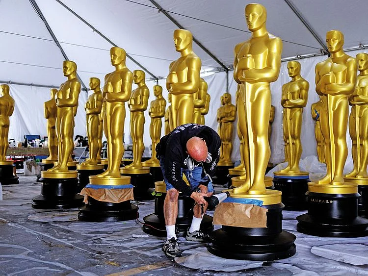 A worker puts the final touches on an Oscar statue in the run-up to the function, at Los Angeles.
